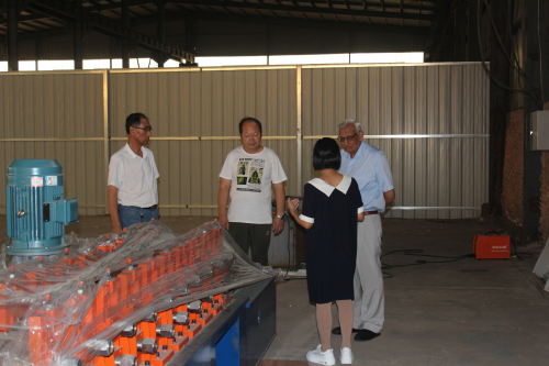 Uganda customer visited our factory for buying metal profile roll forming machines